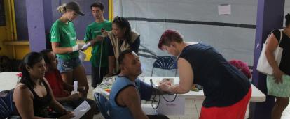 Volunteers helping to check the blood of locals in Belize Projects Abroad volunteers checking blood as part of her Spring Break Public Health Project in Belize